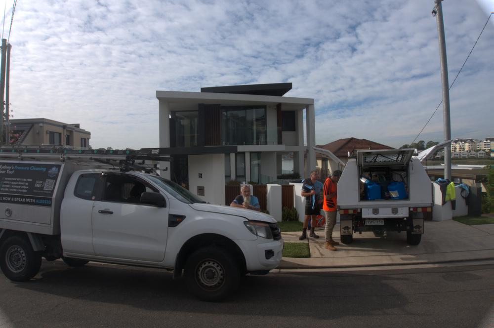 Two ProWash Sydney utes and the crew on a job in Sydney